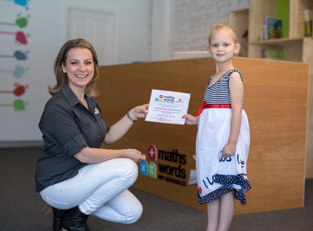 Principal Sia Presenting Certificate of Achievement