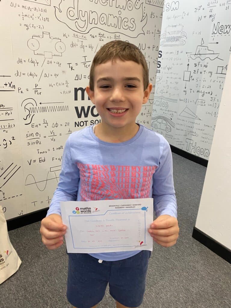 Young Boy Holding Certificate