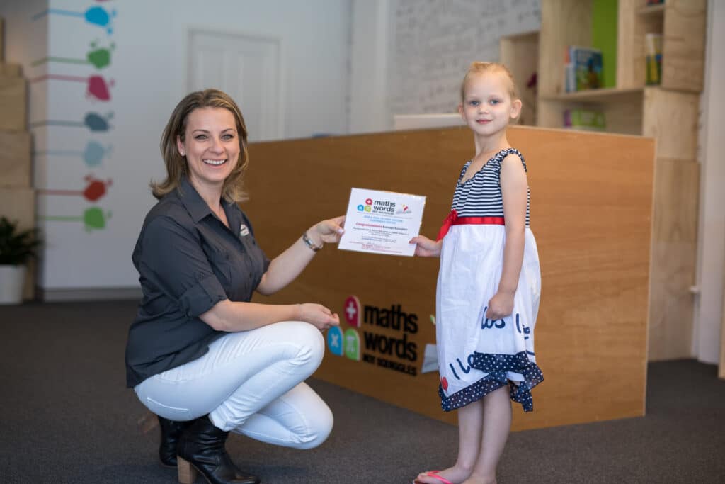 Principal Sia Presenting Certificate to Girl