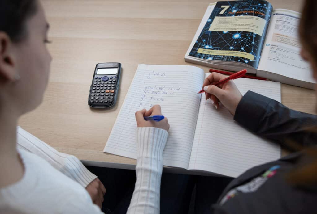 Maths Lesson with Girl and Tutor