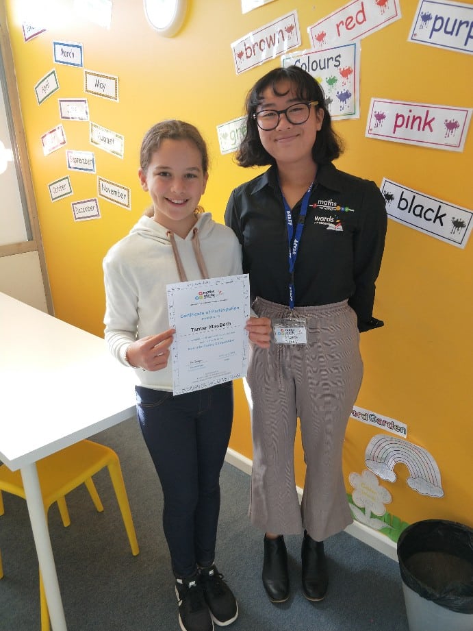 Brookvale Tutor Standing with Girl and Certificate