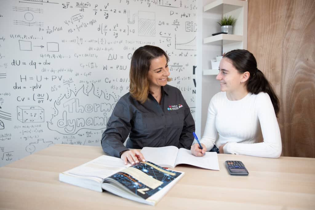 Tutor Smiling At Student