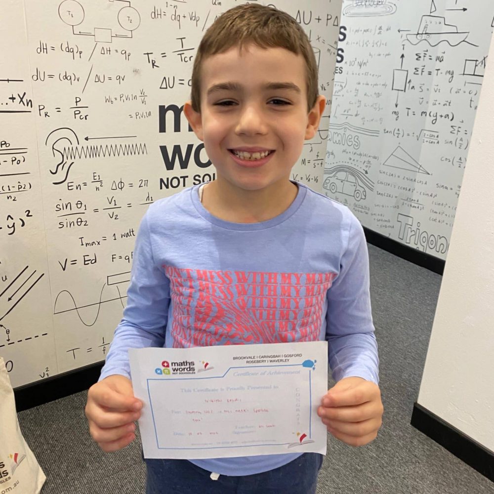 Young Boy Holding Certificate